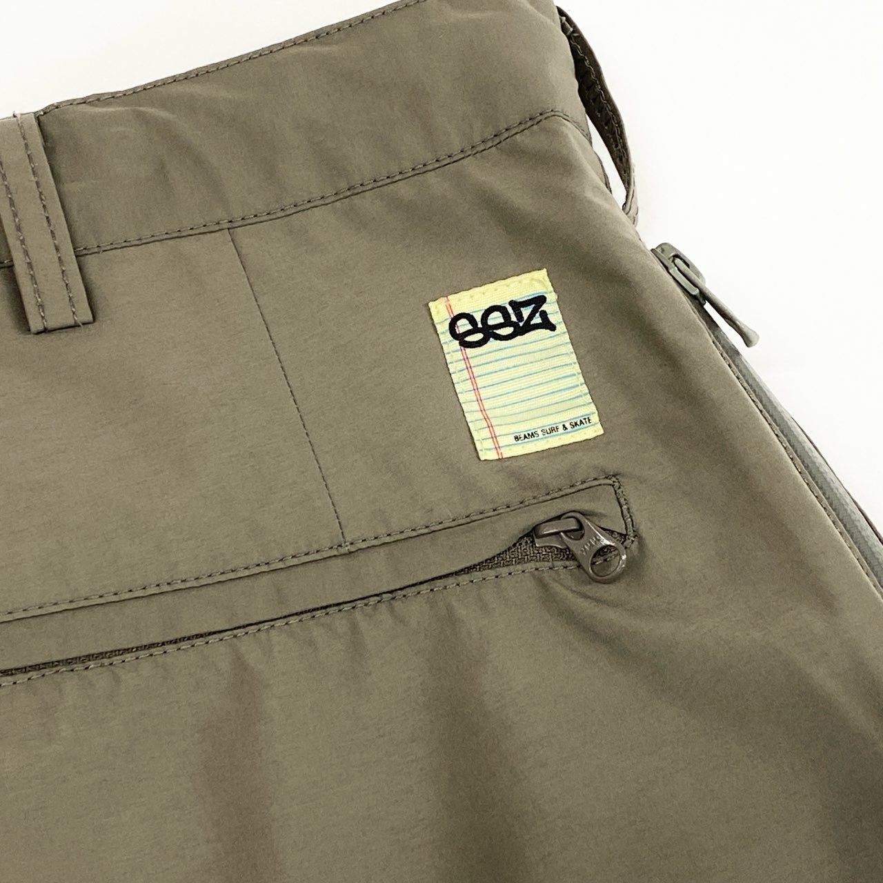 37e2 【美品】 SSZ エスエスズィー SURF&SK8 BEAMS別注 eVent 2P SLACKS ナイロンスラックスパンツ ボトムス 11-23-1344-120 Lサイズ カーキ ナイロン