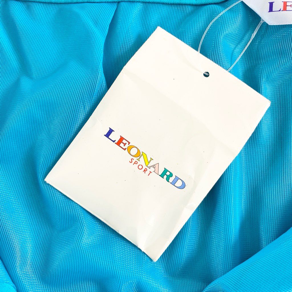 9d9 《新品タグ付き》 LEONARD SPORT レオナール スポーツ 巻きスカート ミニスカート 美しい花柄プリント切替 サイズ64 ライトブルー ポリエステル100% レディース 日本製 春夏
