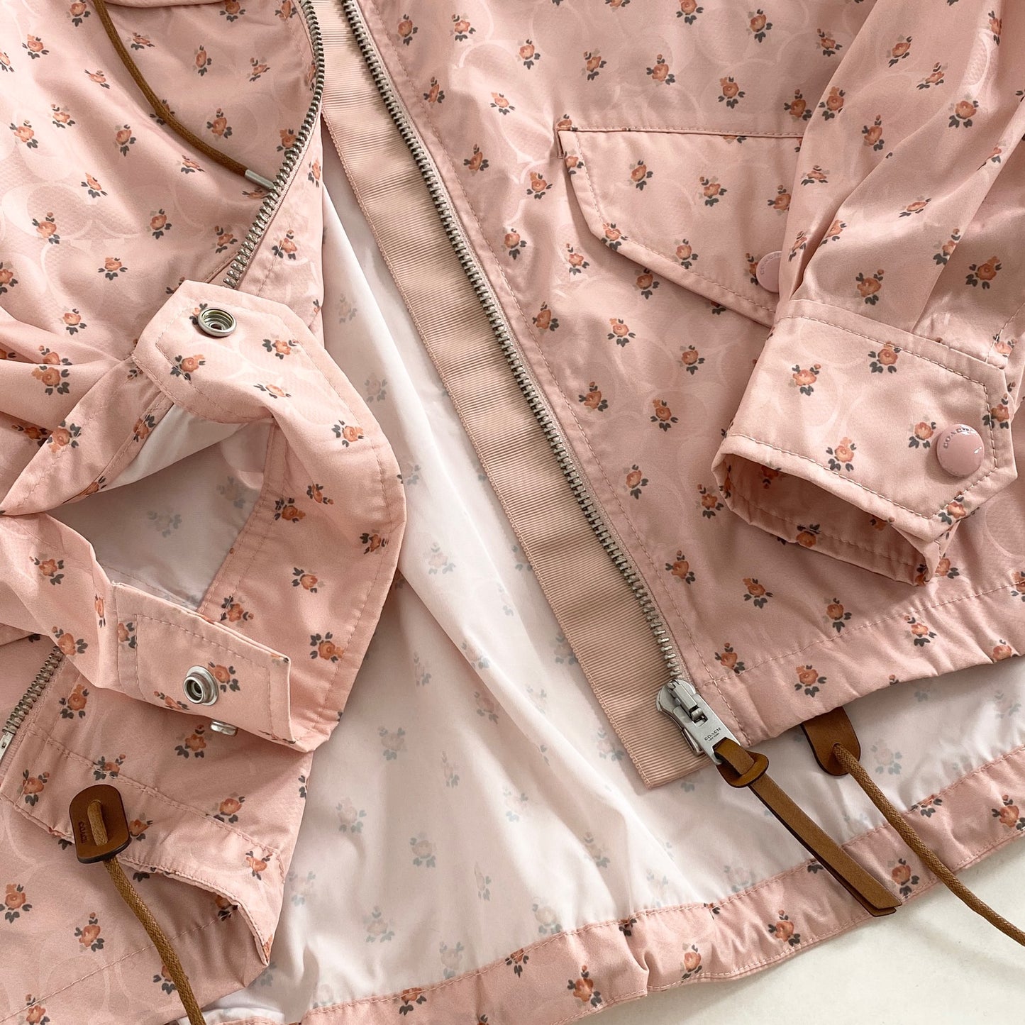 4L9《美品》COACH コーチ SIG FLORAL WNDBRKR ウィンドブレーカー XS ピンク F67477 花柄 フラワー ジャケット