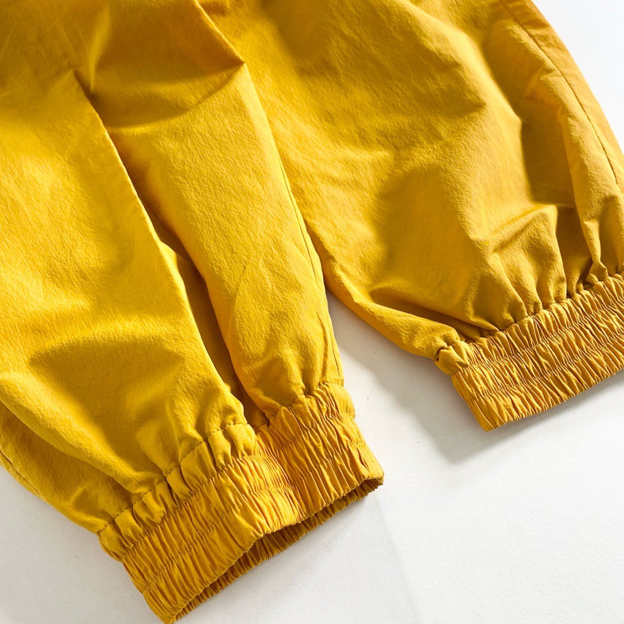 48C13 F/CE. エフシーイー RECYCLE TECH TRACK PANTS テック素材 トラックパンツ M オレンジ メンズ RSU0323M0001