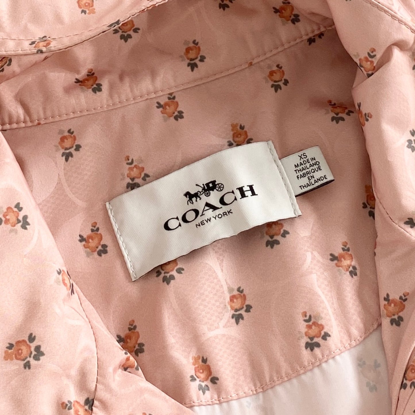 4L9《美品》COACH コーチ SIG FLORAL WNDBRKR ウィンドブレーカー XS ピンク F67477 花柄 フラワー ジャケット