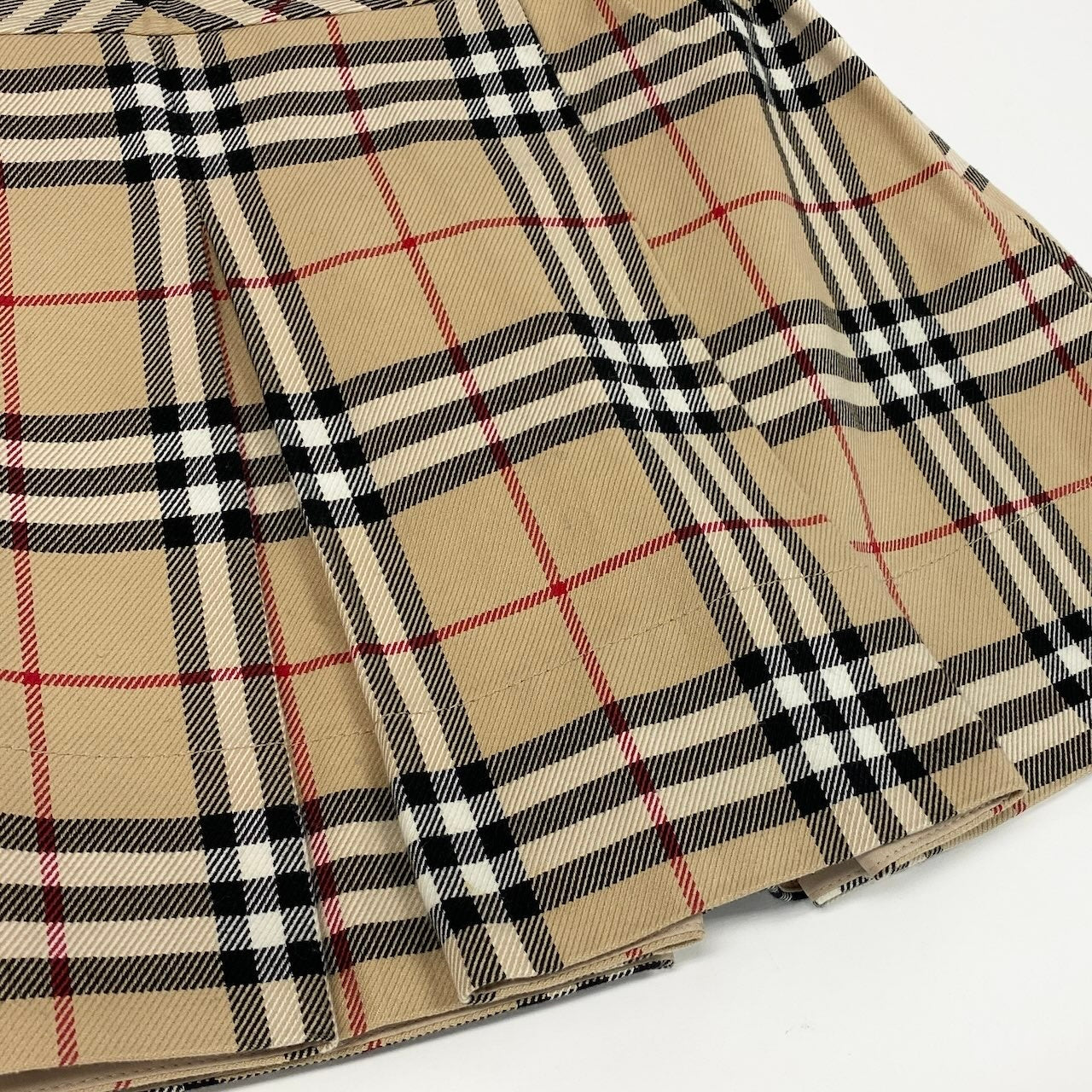 20d18 BURBERRY LONDON BLUE LABEL バーバリーロンドン ブルーレーベル ノバチェック ミニスカート タックスカート ロゴボタン サイズ36 ベージュ レディース 女性用u02t