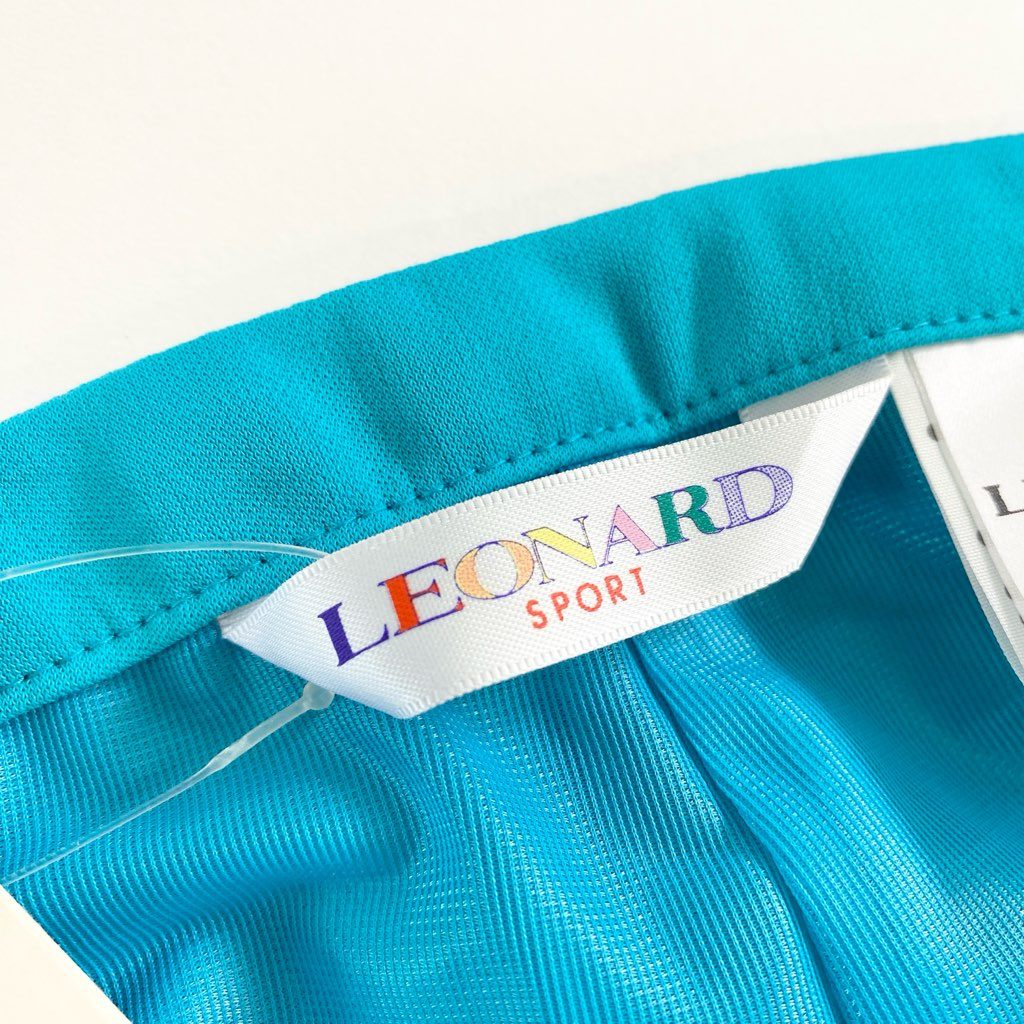 9d9 《新品タグ付き》 LEONARD SPORT レオナール スポーツ 巻きスカート ミニスカート 美しい花柄プリント切替 サイズ64 ライトブルー ポリエステル100％ レディース 日本製