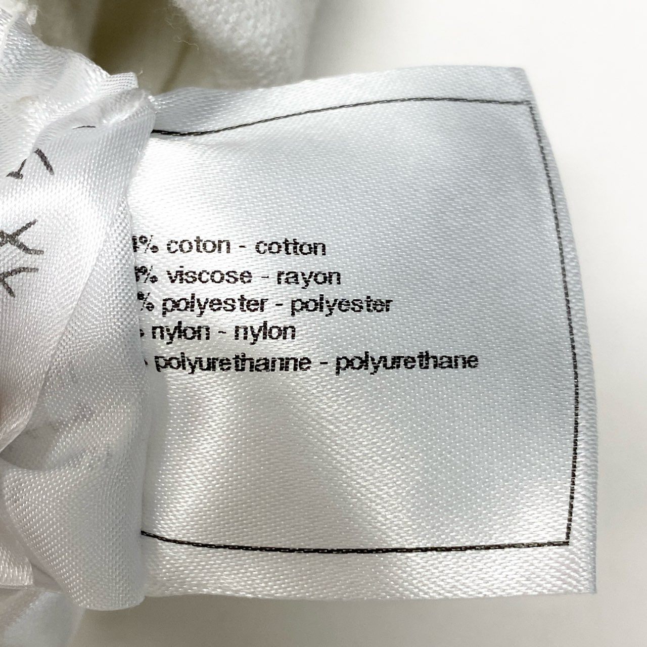 42b27 CHANEL シャネル P45288 ココマーク付き ジャガード カメリア ニットスカート サイズ36 ホワイト レディースk02i