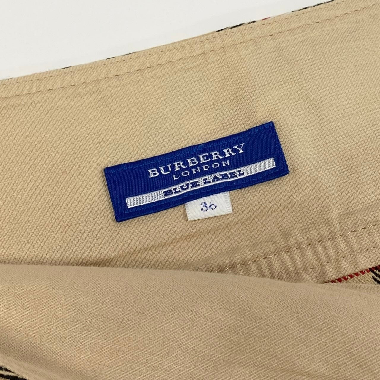 20d18 BURBERRY LONDON BLUE LABEL バーバリーロンドン ブルーレーベル ノバチェック ミニスカート タックスカート ロゴボタン サイズ36 ベージュ レディース 女性用u02t