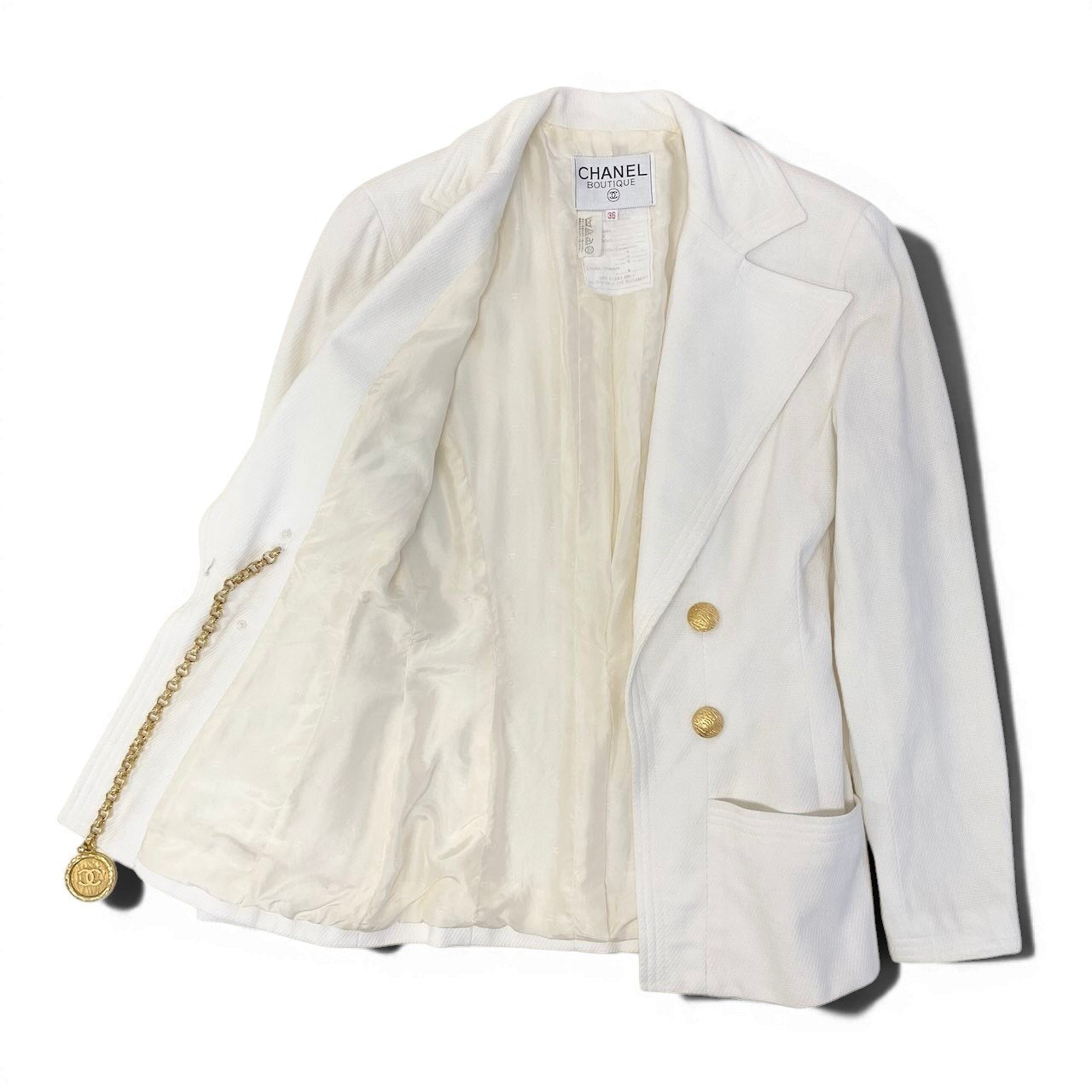 Ce27 CHANEL BOUTIQUE シャネル テーラードジャケット ココマークチェーン 金ボタン サイズ36 ホワイト レディース 女性服ta1