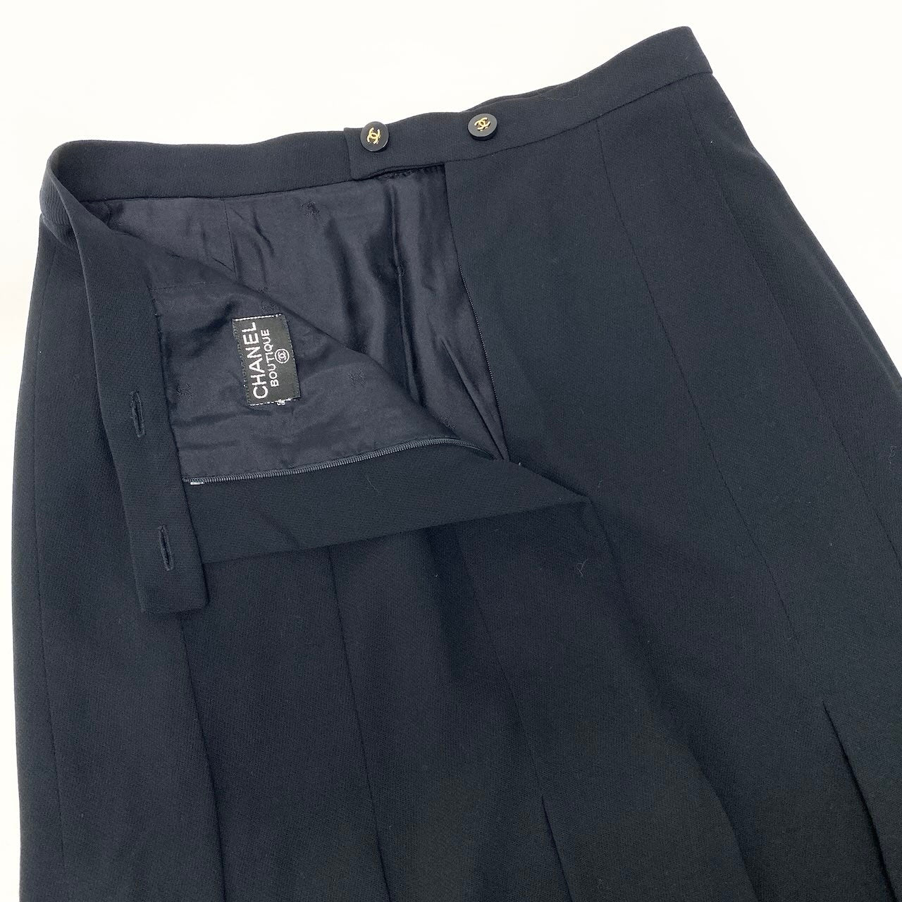 Cd22 CHANEL BOUTIQUE シャネル プリーツスカート ひざ丈スカート ココマークボタン  ネイビー ウール100％ レディース 女性服u02t