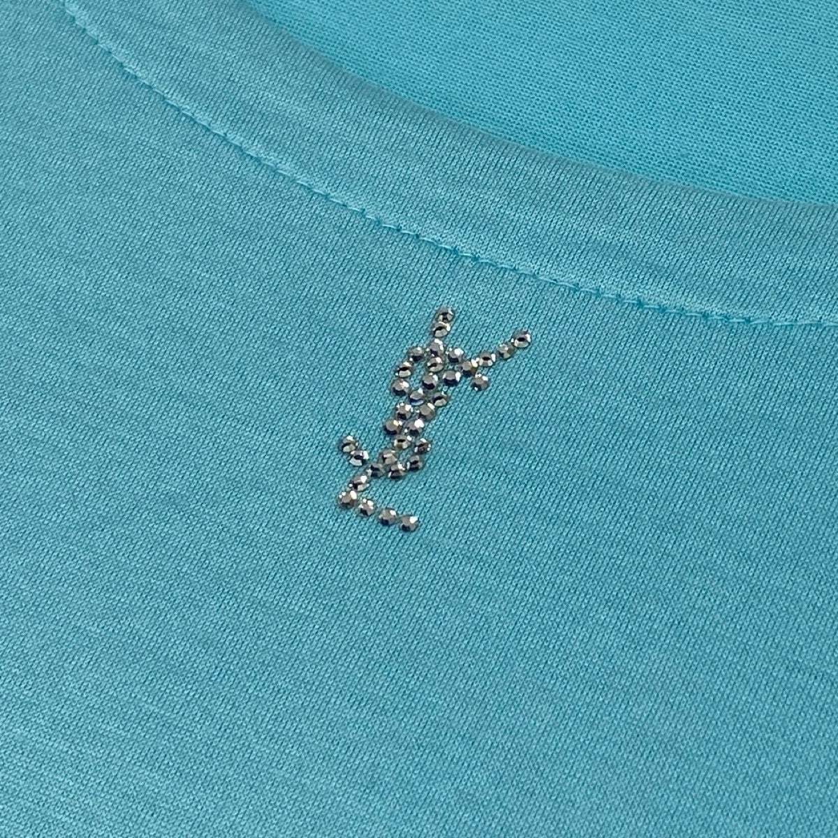 Ig16 YVES SAINT LAURENT イヴサンローラン ラインストーンカサンドラロゴ 半袖Tシャツ サイズM ライトブルー コットン100％ レディースu02t