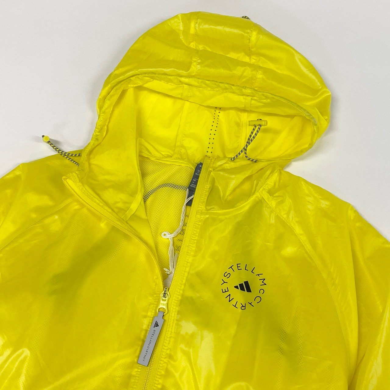 78i10《未使用品》タグ付 adidas by Stella McCartney アディダス ステラマッカートニー TruePace ランニングジャケット ロゴプリント 軽量 リフレクター HS8197 Mサイズ イエロー レディースo07t